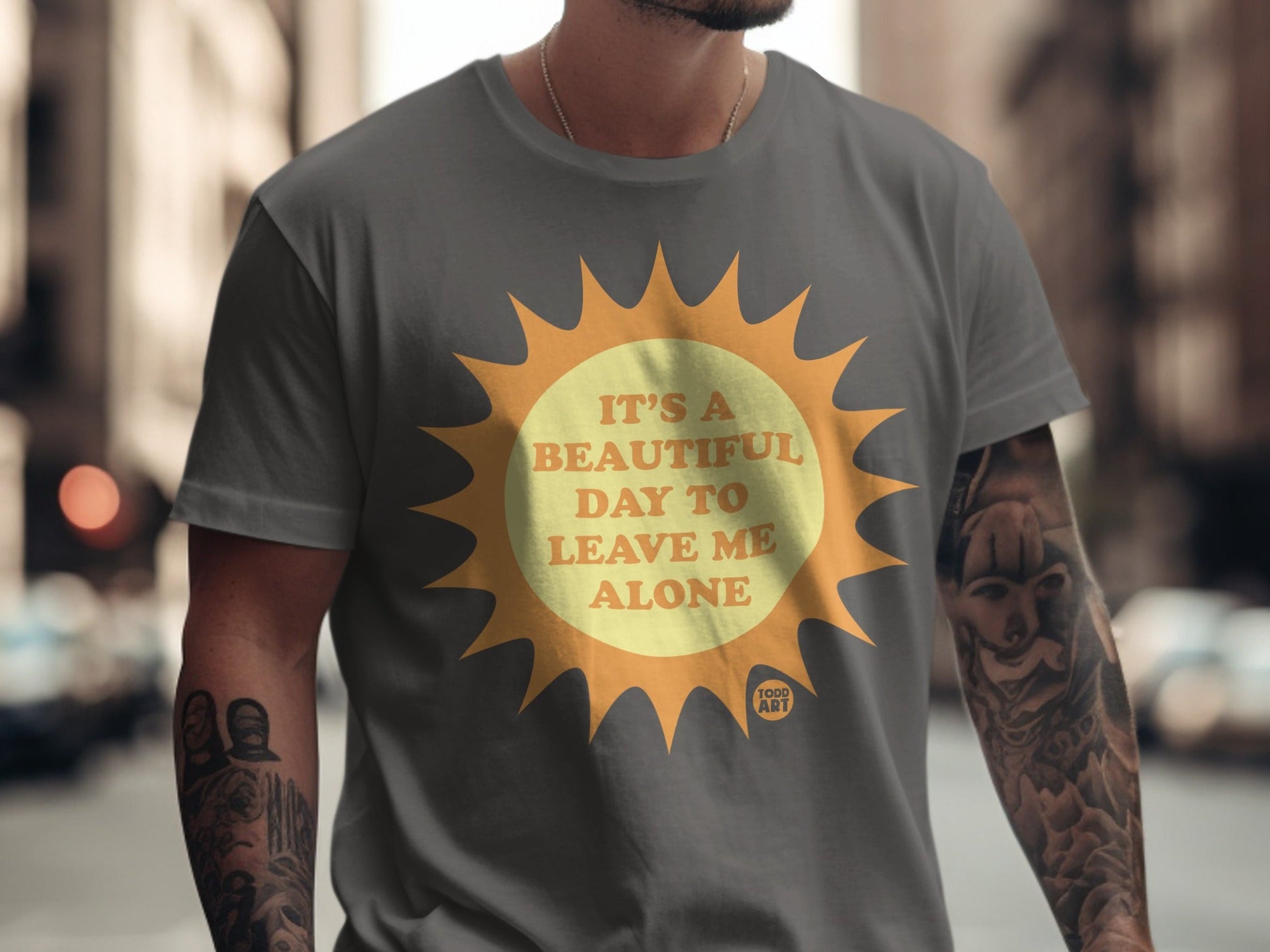 Gray t-shirt with yellow sun graphic and text "It's a beautiful day to leave me alone".