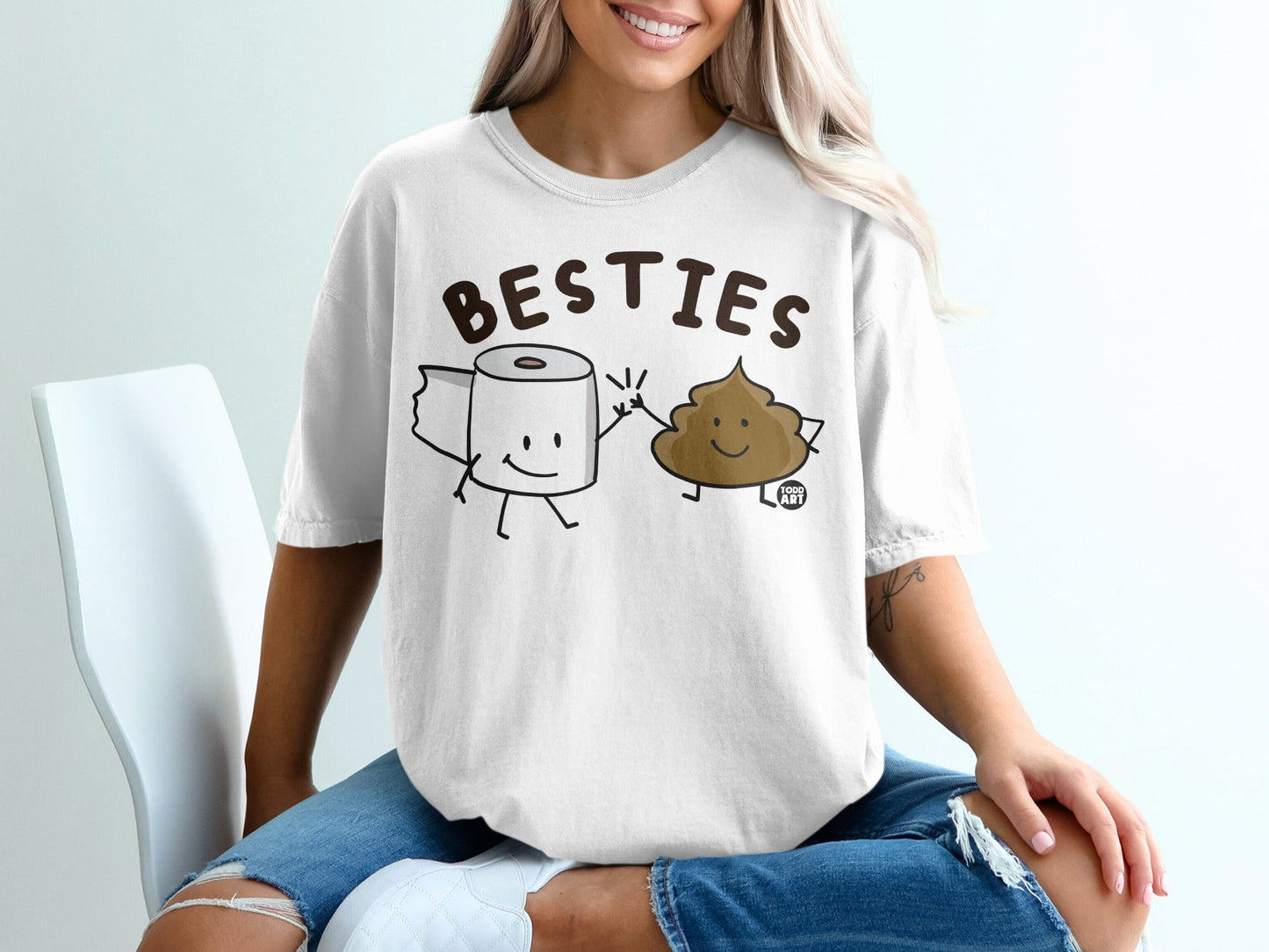 Toilet paper roll and smiling poop characters wearing "BESTIES" graphic t-shirt.