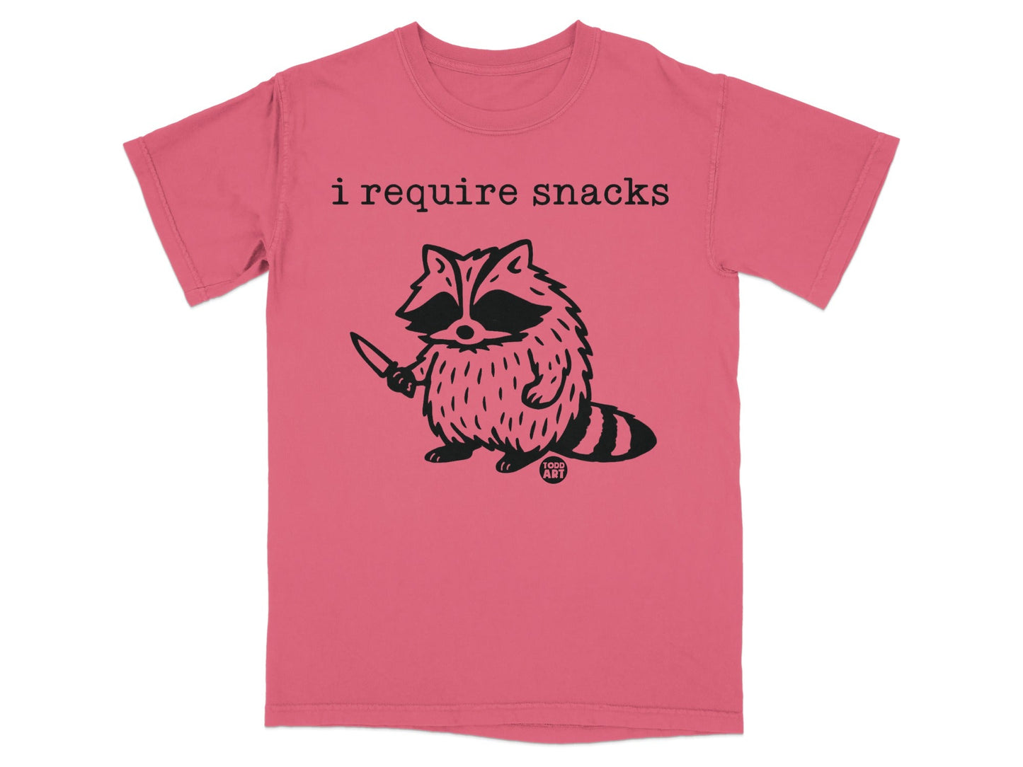 T-shirt with a raccoon holding a knife and text "i require snacks".