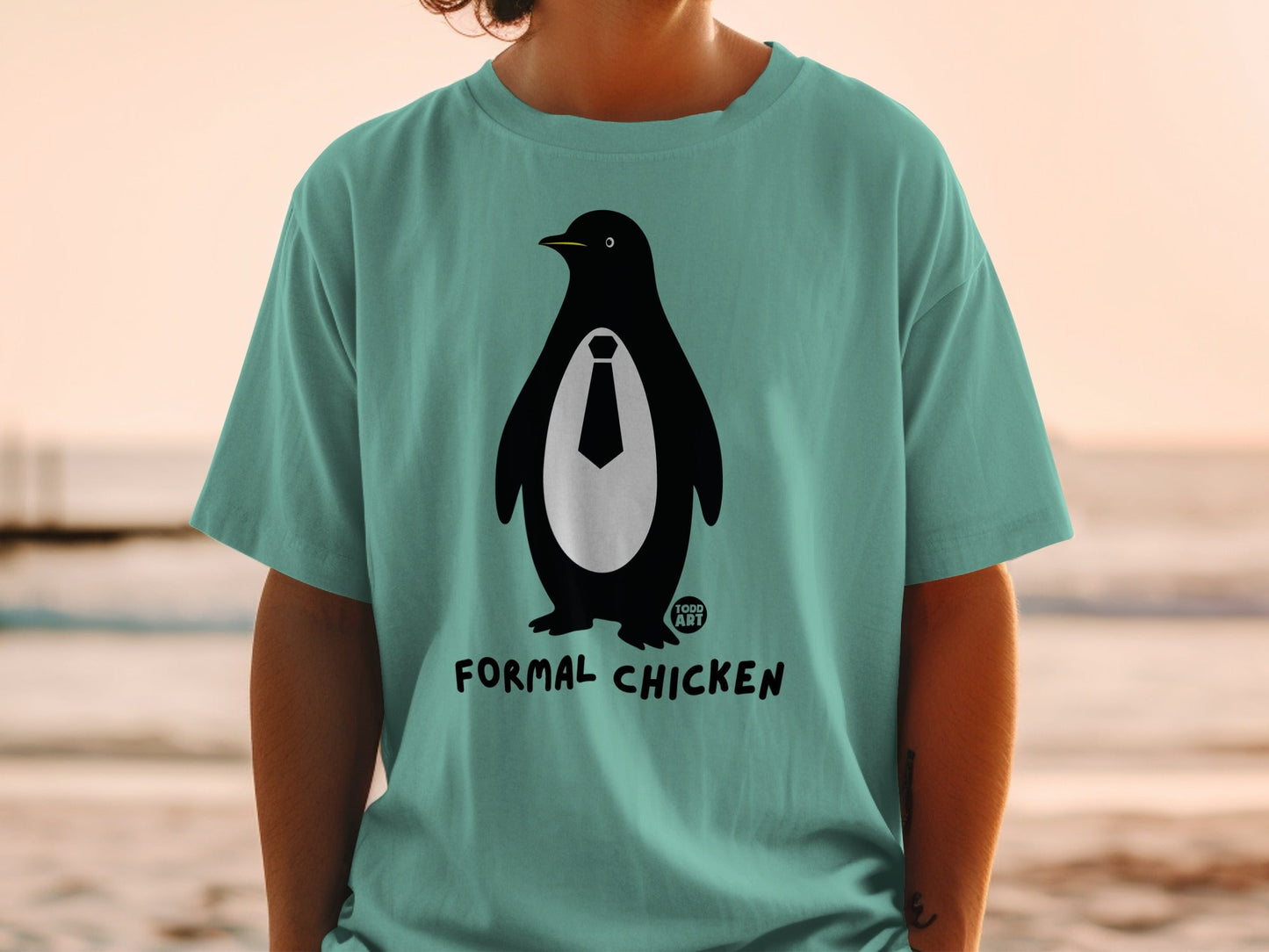 Teal t-shirt with a penguin wearing a tie and "FORMAL CHICKEN" text.