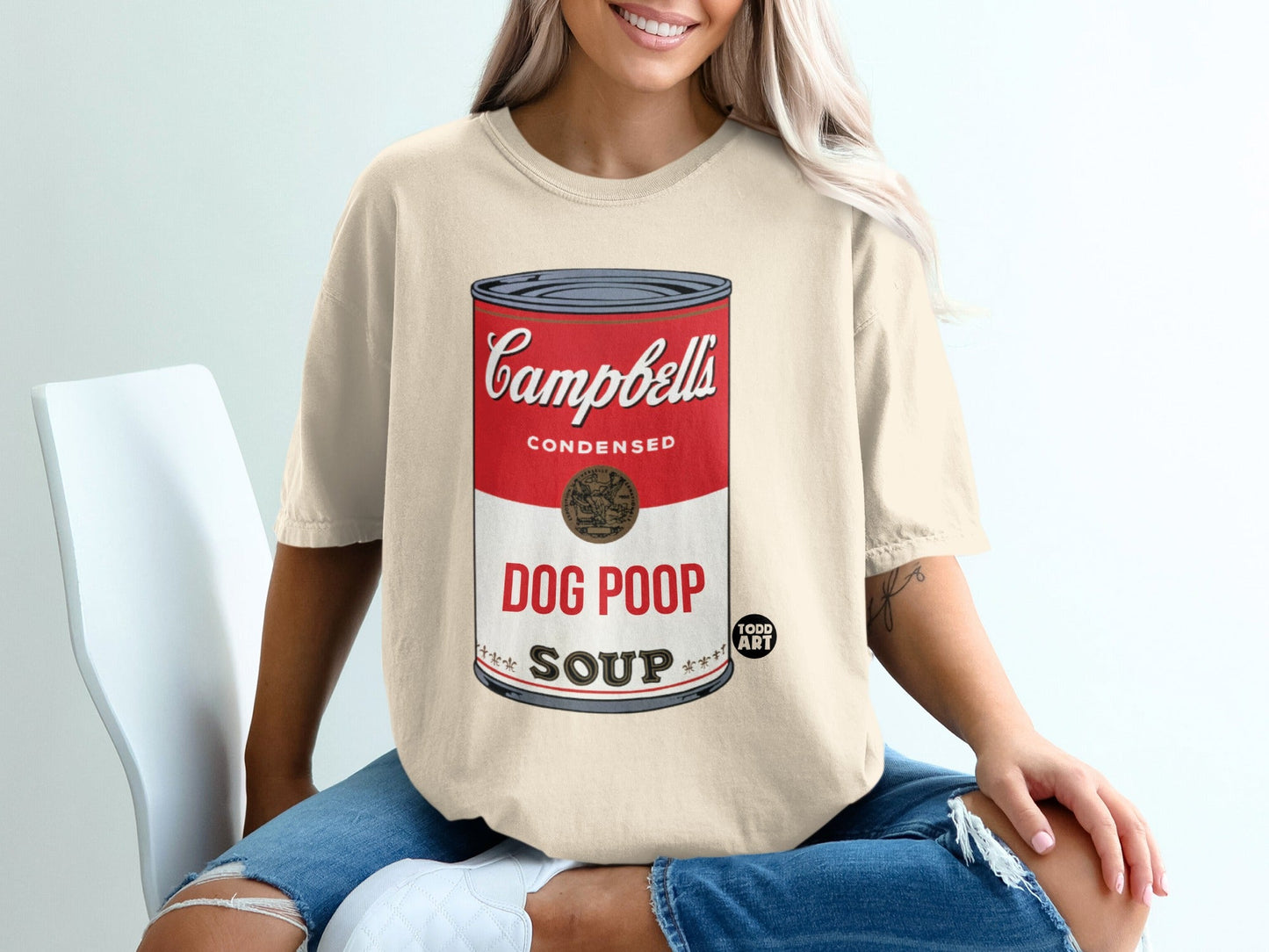 Beige t-shirt with "Campbell's Dog Poop Soup" design.