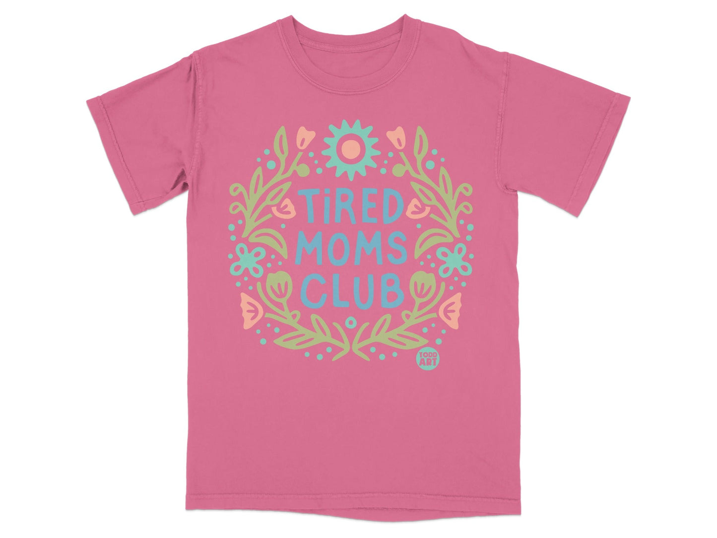 Pink t-shirt with "Tired Moms Club" floral design and "TODD ART" logo.