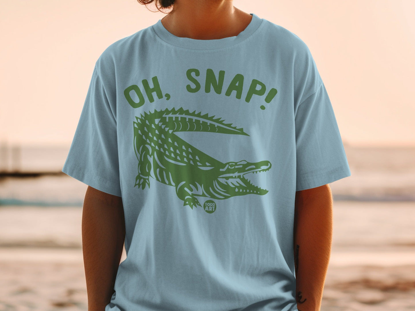 Light blue t-shirt with "OH, SNAP!" and green alligator graphic.