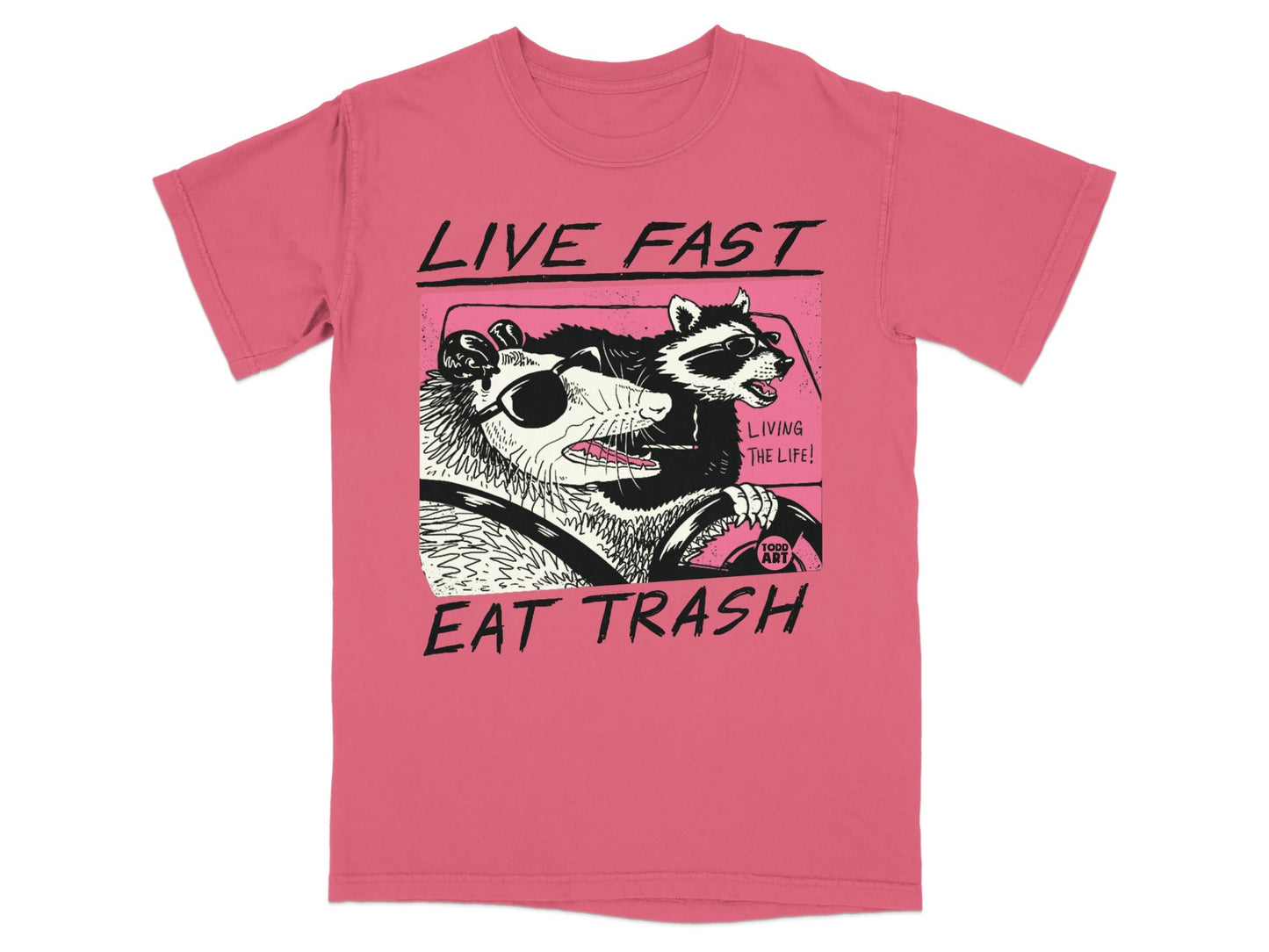 T-shirt graphic of a possum and raccoon driving, "Live Fast Eat Trash".