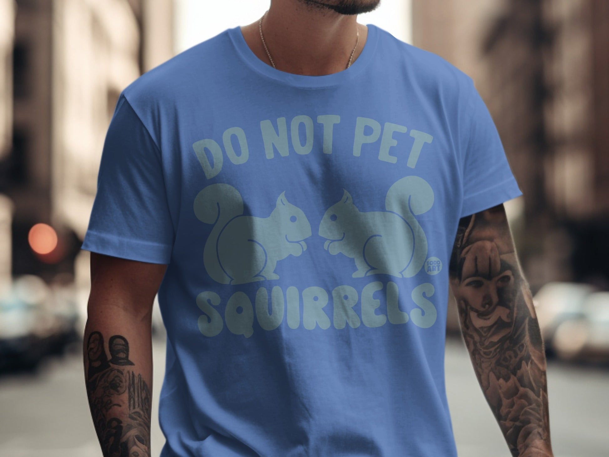 Blue t-shirt with "DO NOT PET SQUIRRELS" and two squirrel graphics.