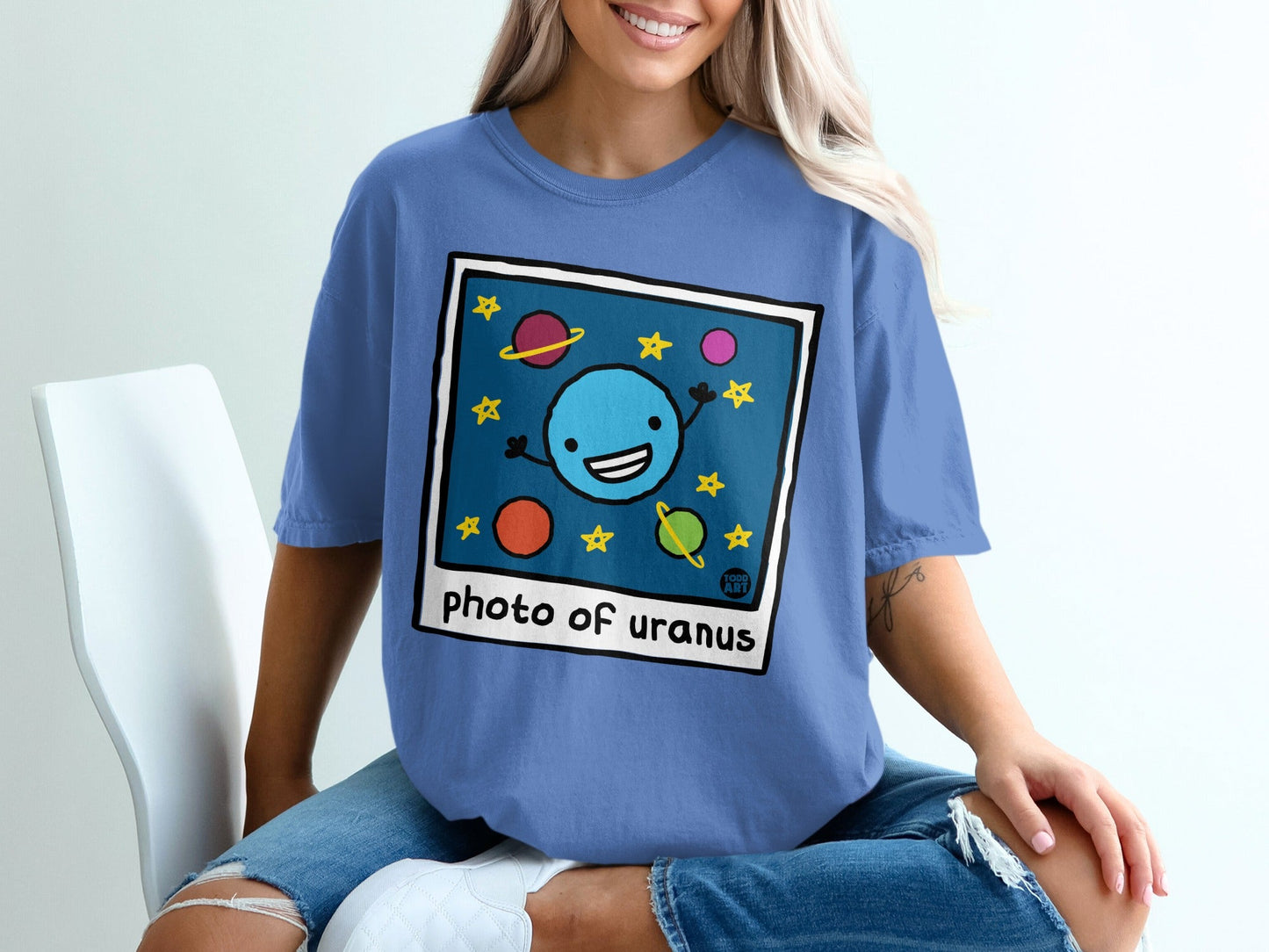 Blue t-shirt with cartoon "photo of uranus" graphic and planets.