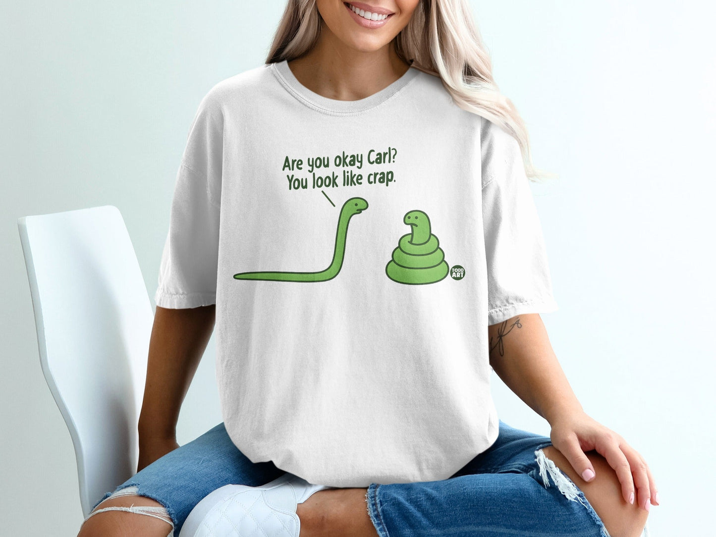 Cartoon snakes on a white t-shirt, one asking "Are you okay Carl?".