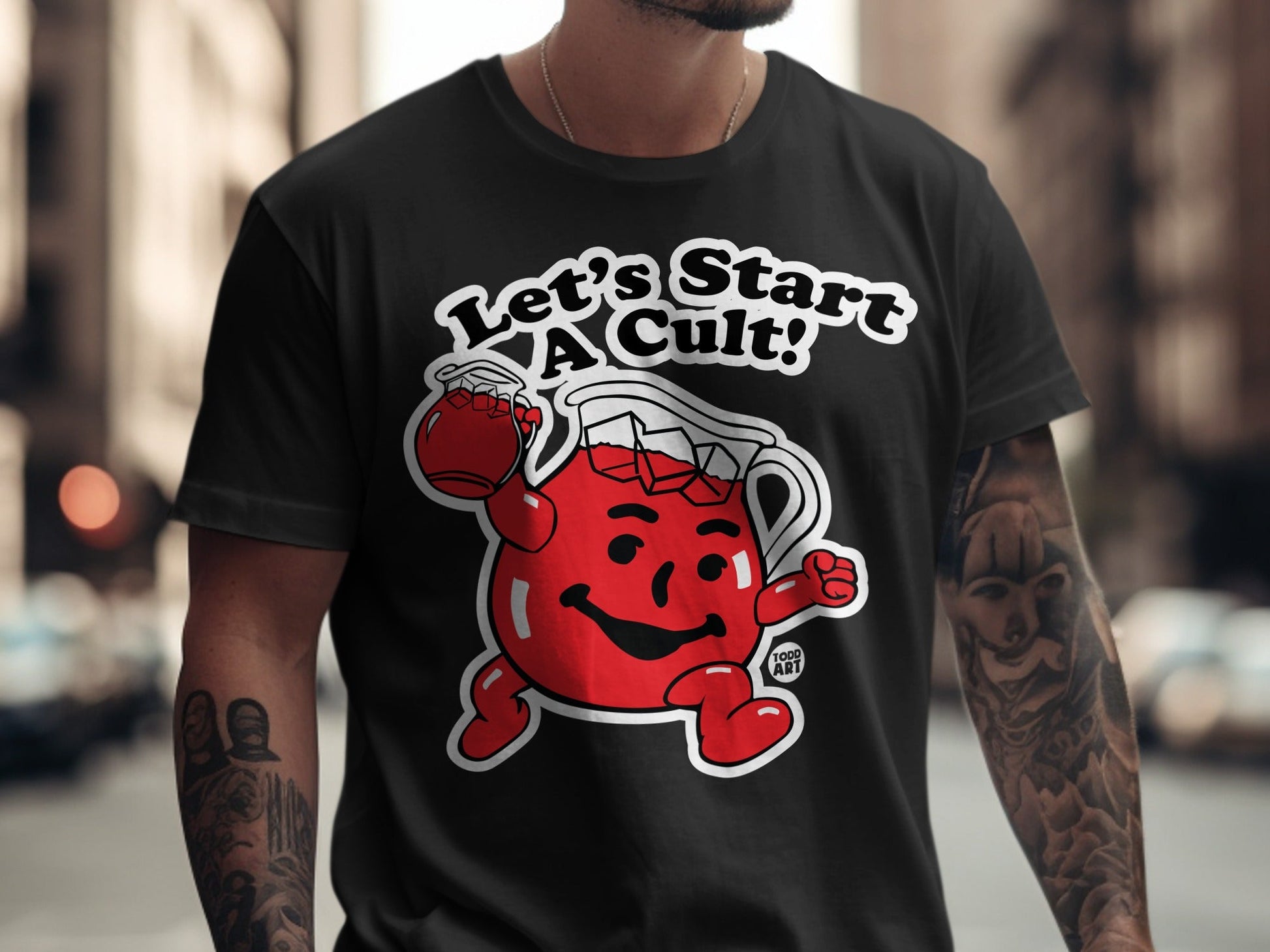 Black t-shirt with Kool-Aid Man graphic and "Let's Start a Cult!" text.