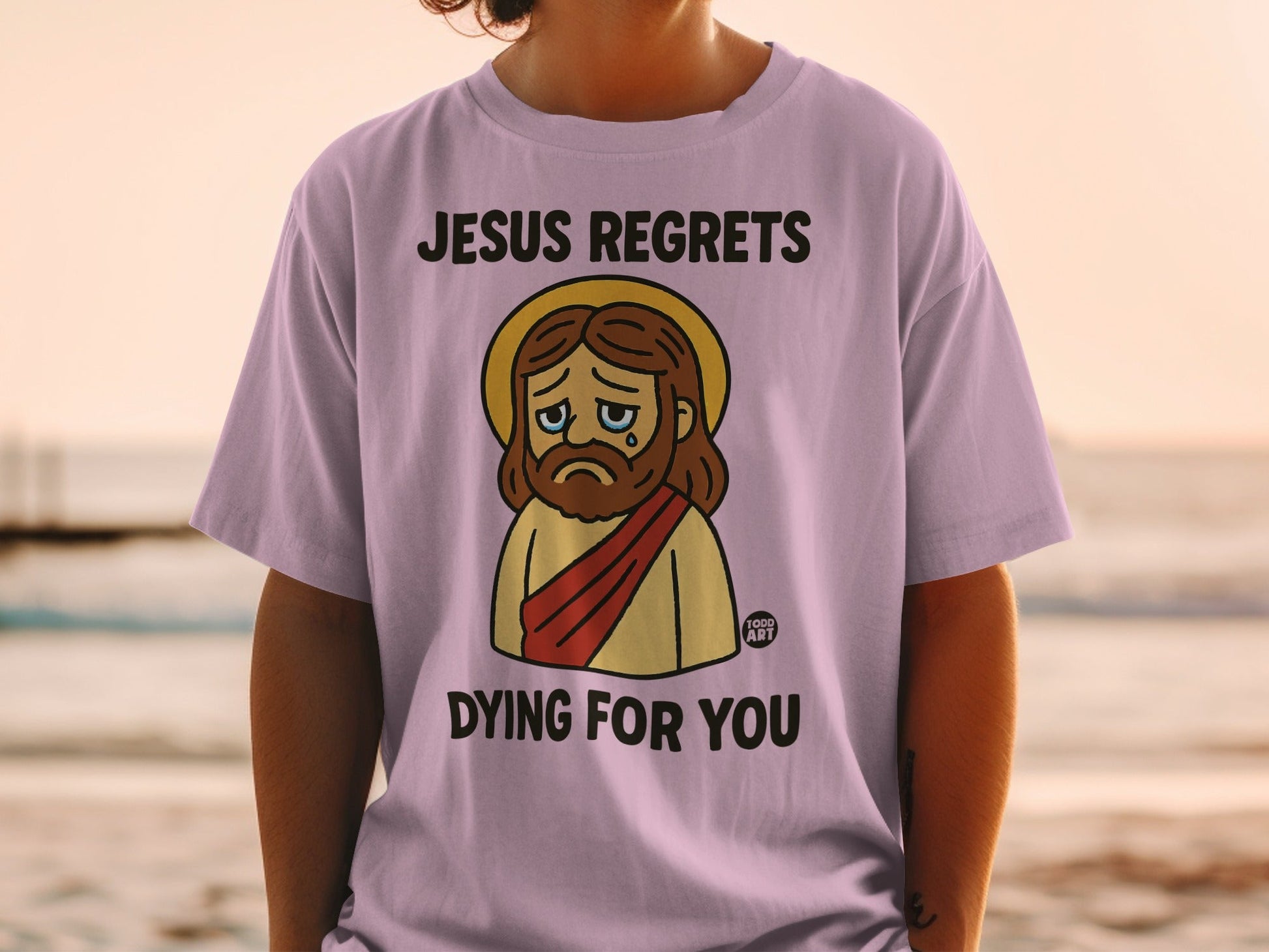 Jesus graphic t-shirt with "Jesus Regrets Dying For You" text.