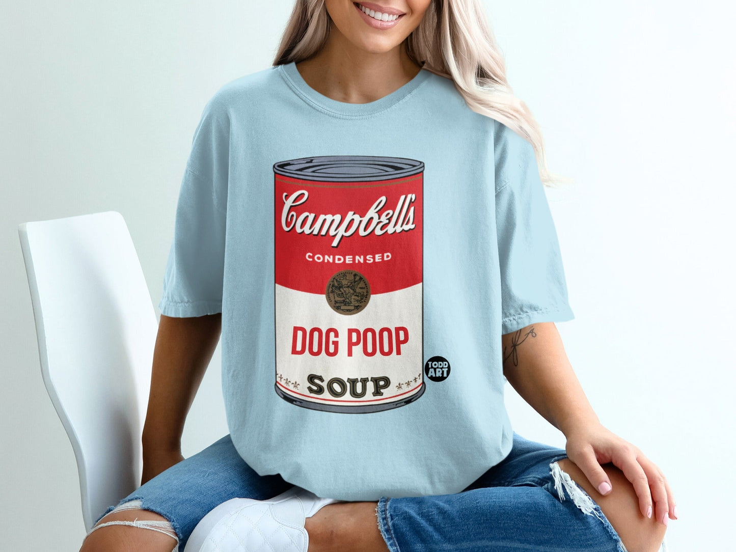Light blue t-shirt with "Campbell's Condensed Dog Poop Soup" label.