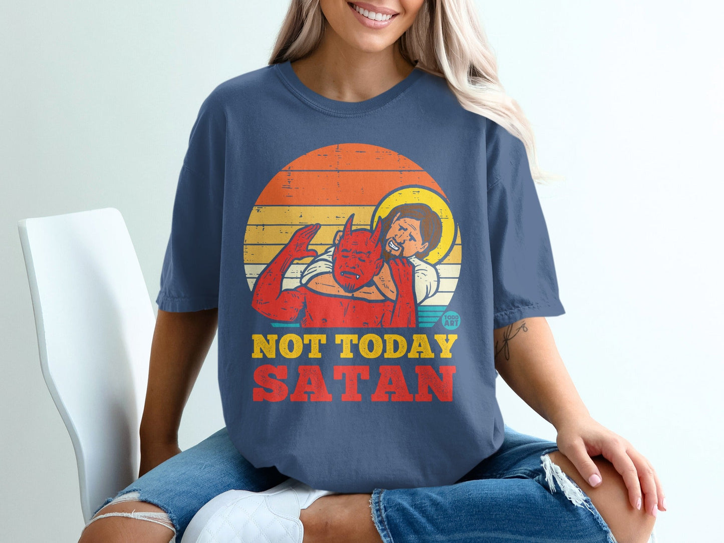 T-shirt graphic of Jesus holding a devil with text "NOT TODAY SATAN".