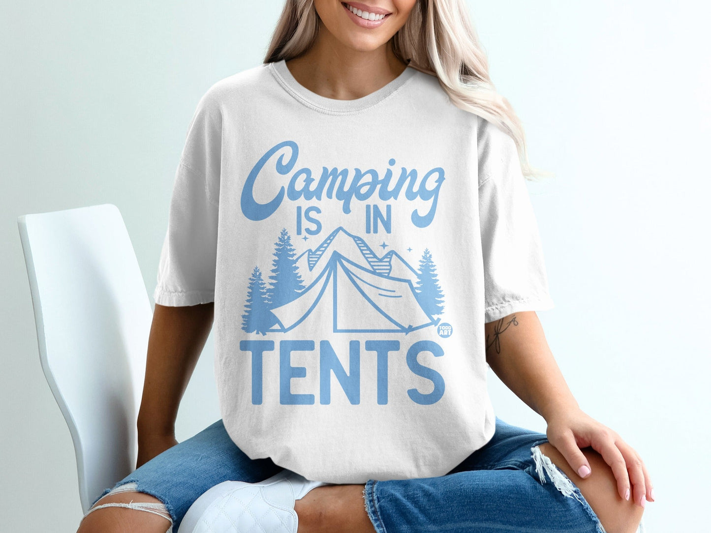 Light blue t-shirt with "Camping is in TENTS" text and tent graphic.