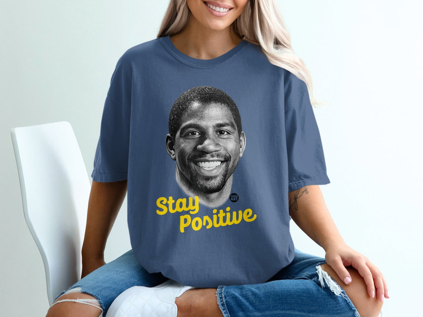 Blue t-shirt with Magic Johnson portrait and "Stay Positive" text.