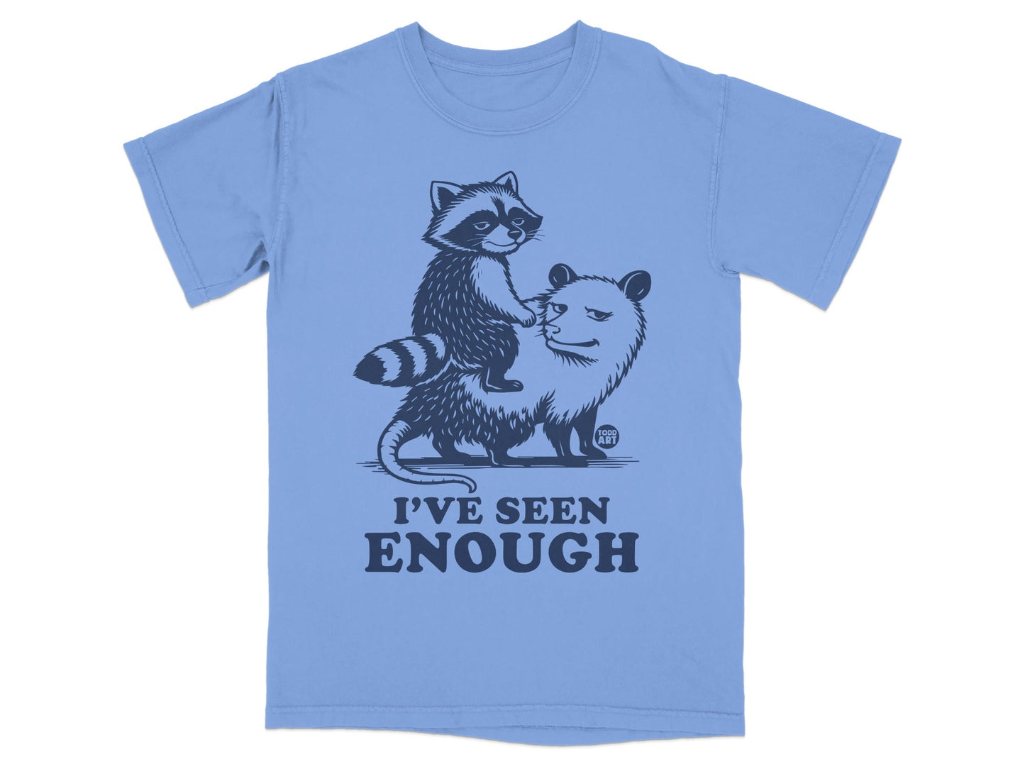 T-shirt graphic of a raccoon riding an opossum, text "I'VE SEEN ENOUGH".