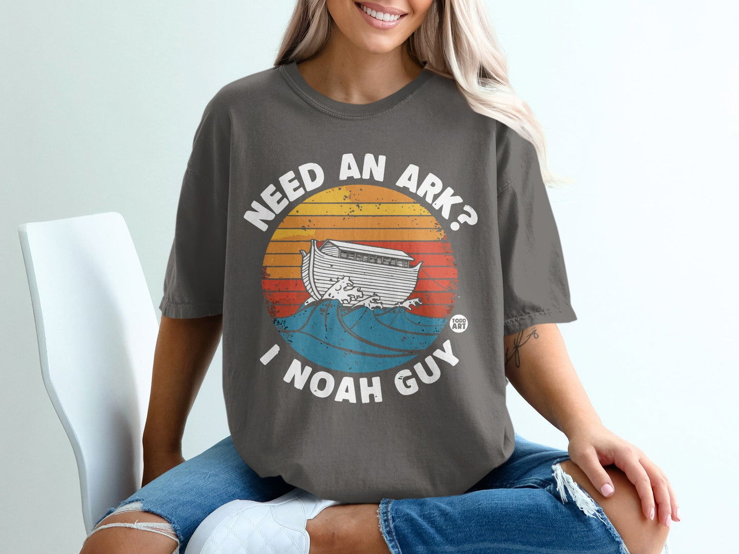 T-shirt with "Need an Ark? I Noah Guy" text and Noah's Ark on waves.