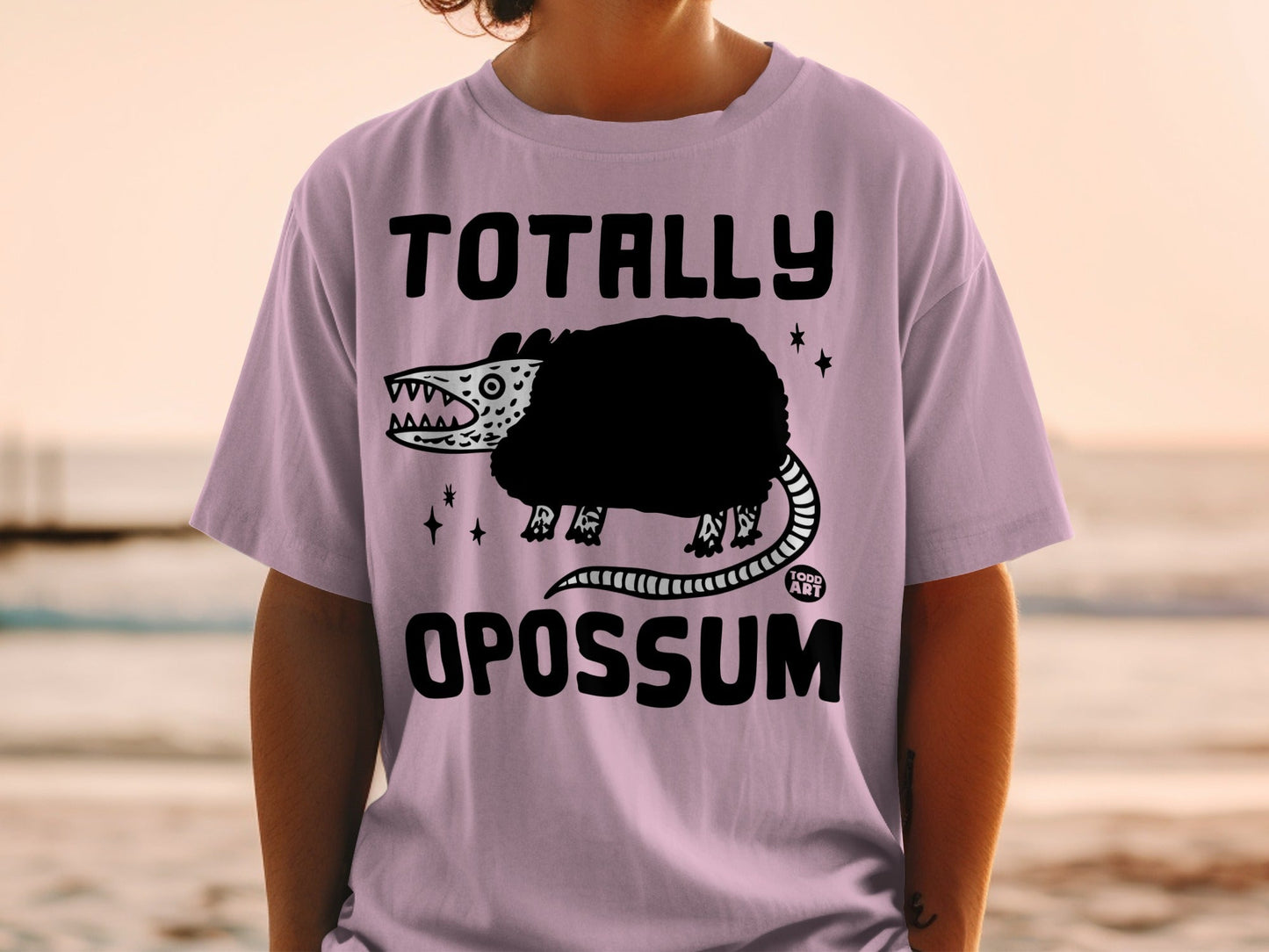 Light purple t-shirt with "Totally Opossum" and cartoon opossum graphic.