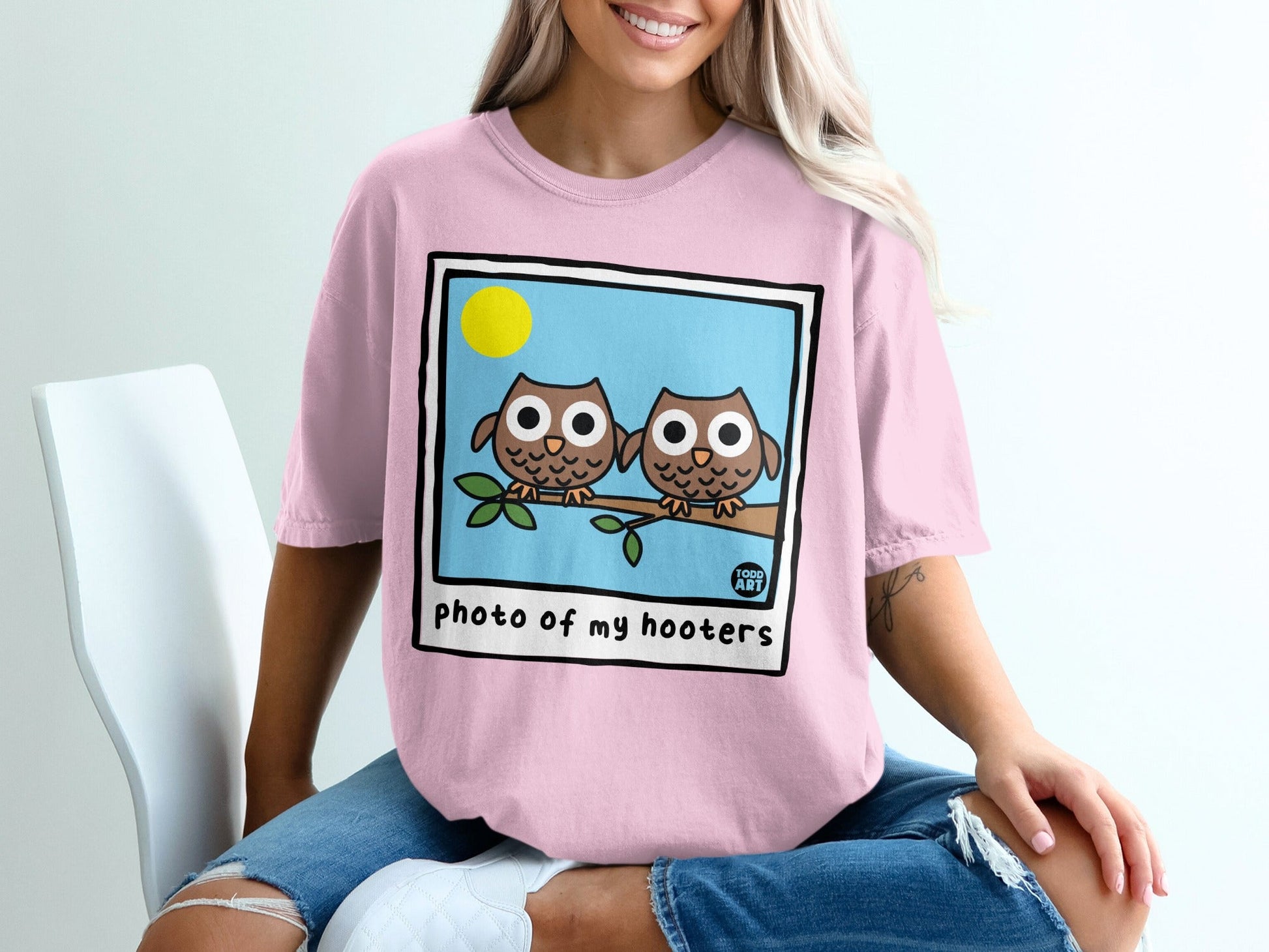 Two cartoon owls perched on a branch, "photo of my hooters" text.