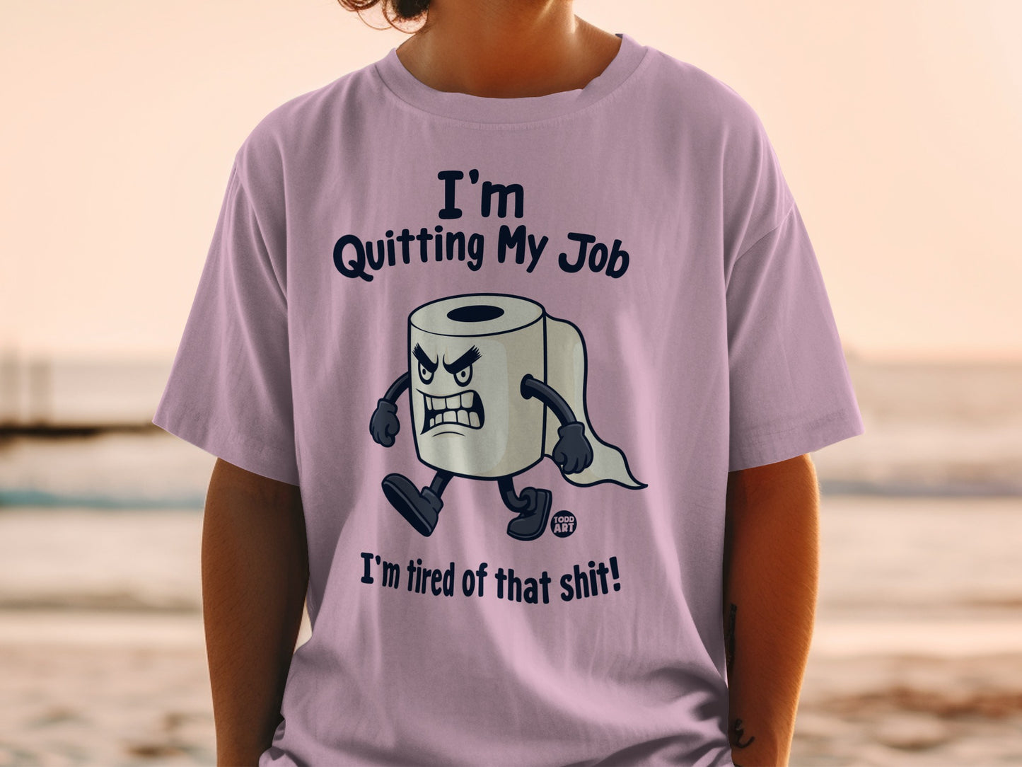 Lilac t-shirt with a cartoon toilet paper character stating "I'm Quitting My Job, I'm tired of that shit!"