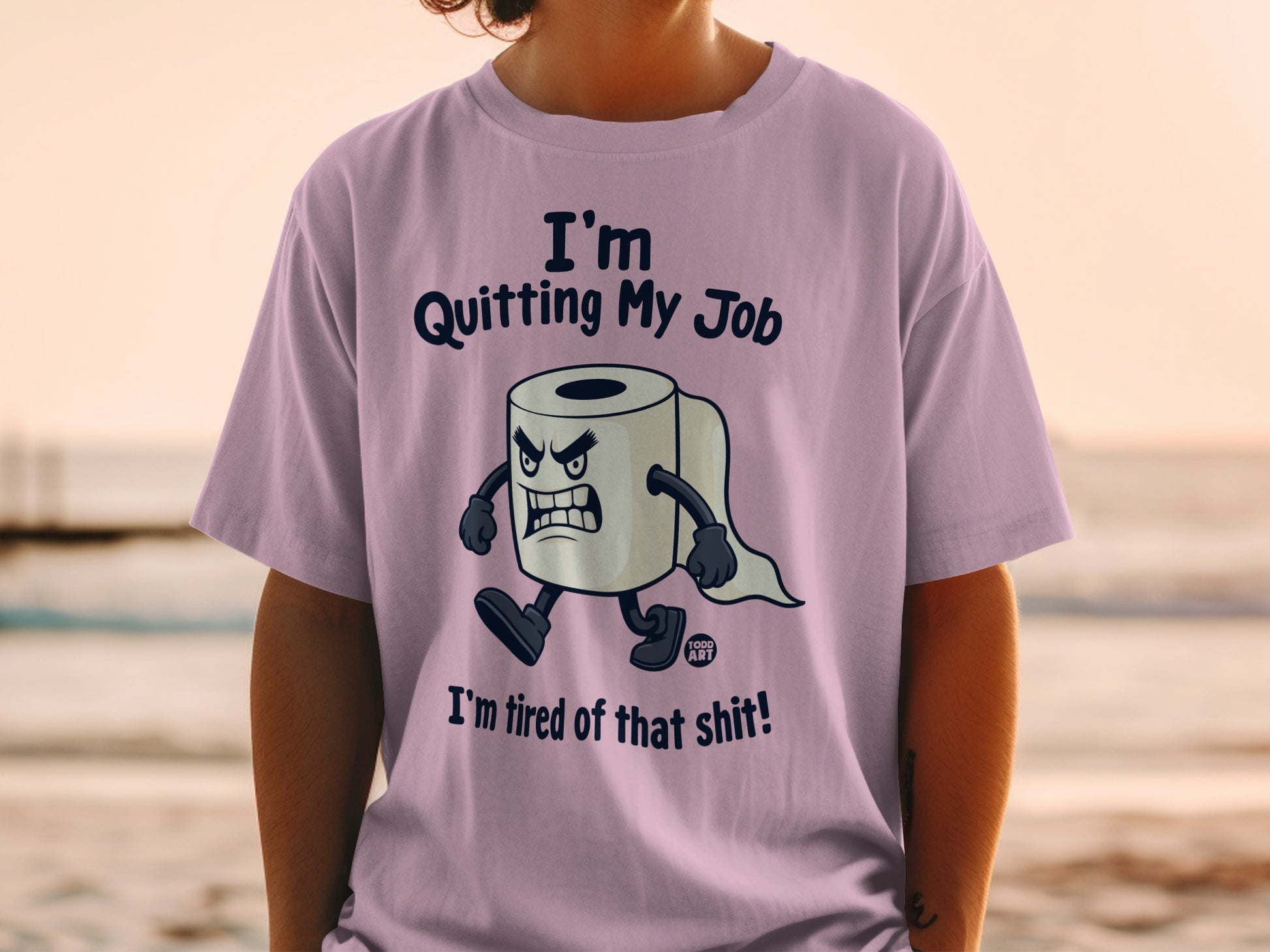 Lilac t-shirt with a cartoon toilet paper character stating "I'm Quitting My Job, I'm tired of that shit!"