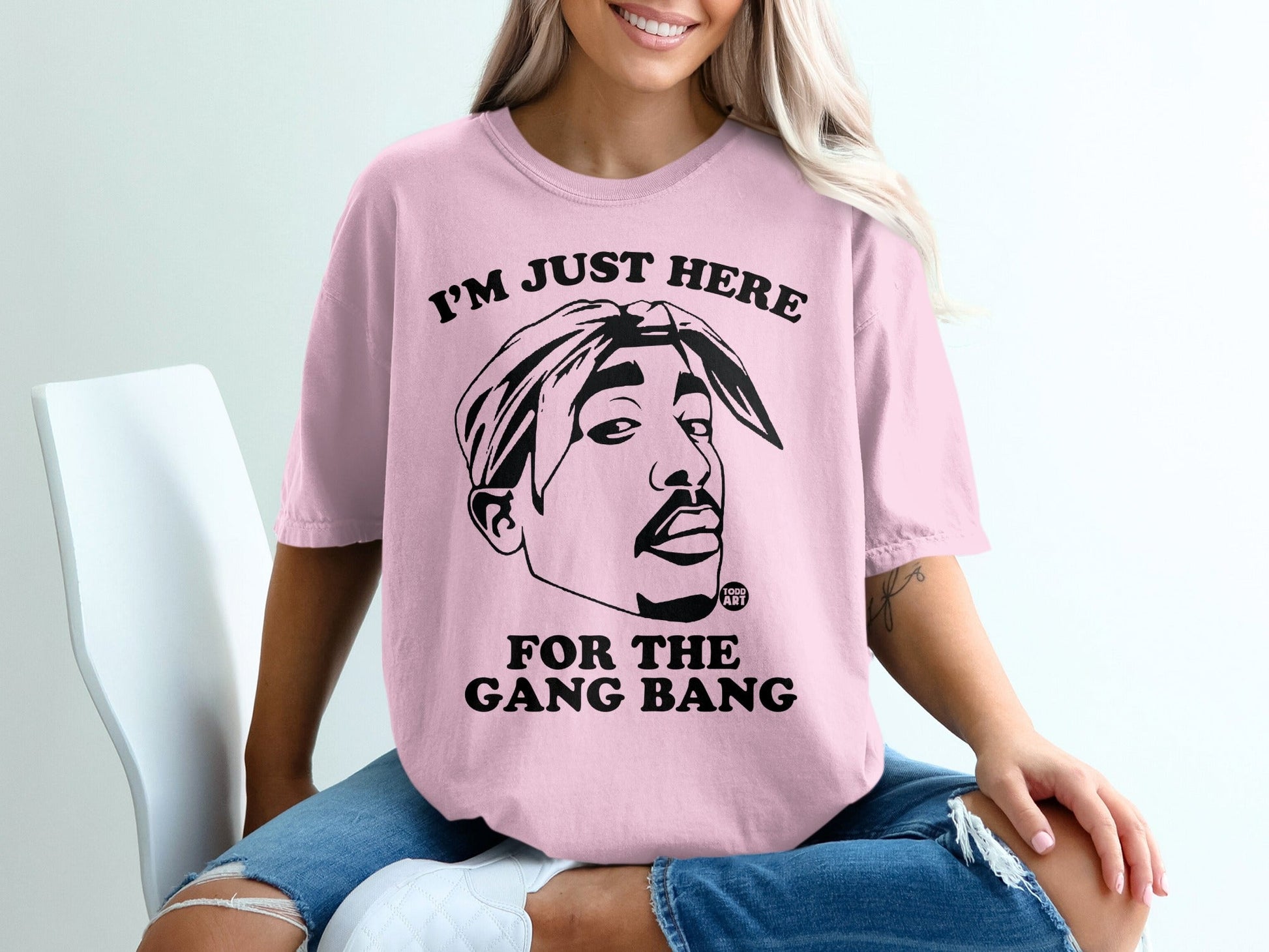 Pink t-shirt with Tupac Shakur graphic and text "I'M JUST HERE FOR THE GANG BANG".
