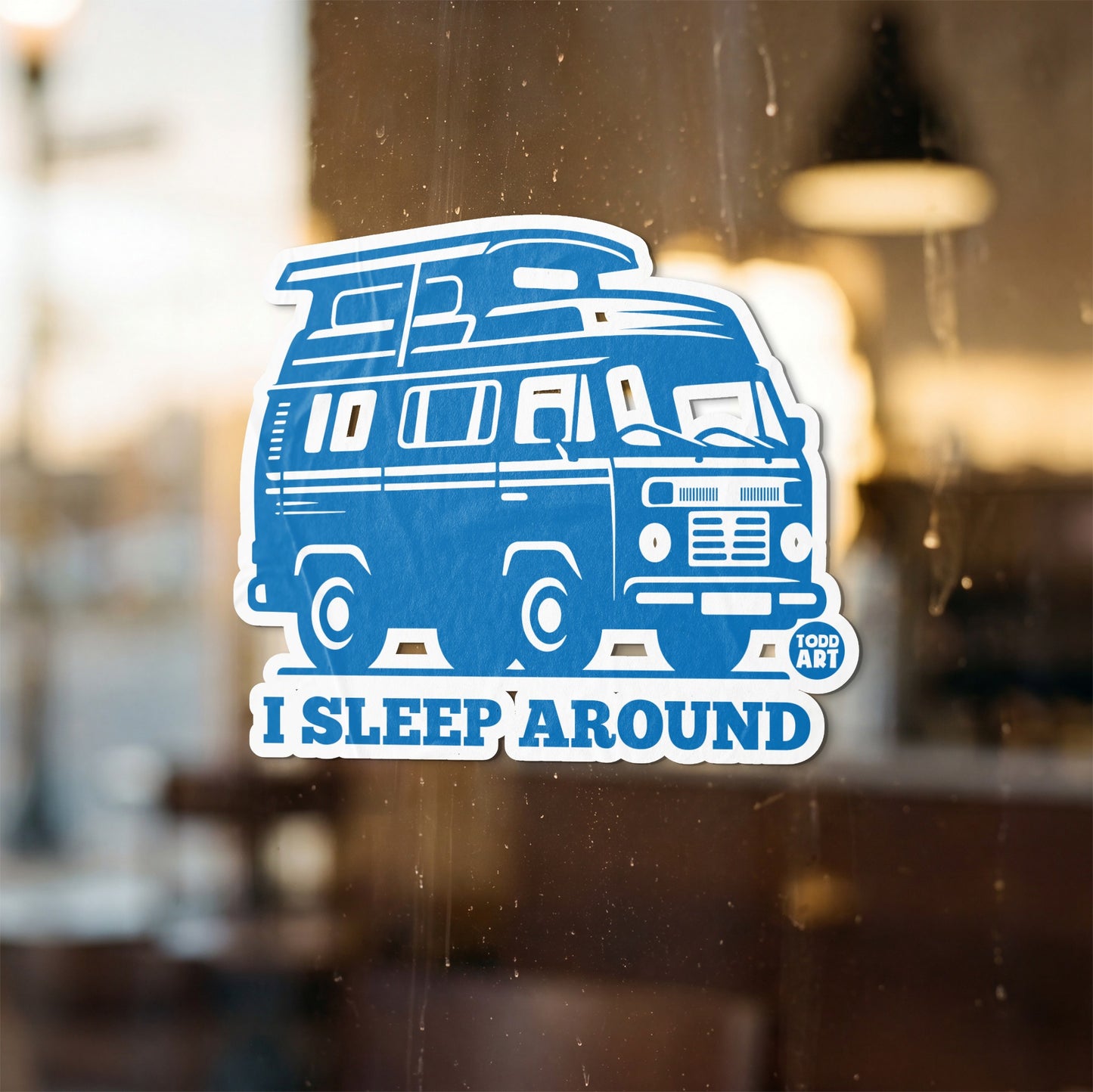 Blue sticker of a van with "I SLEEP AROUND" text.