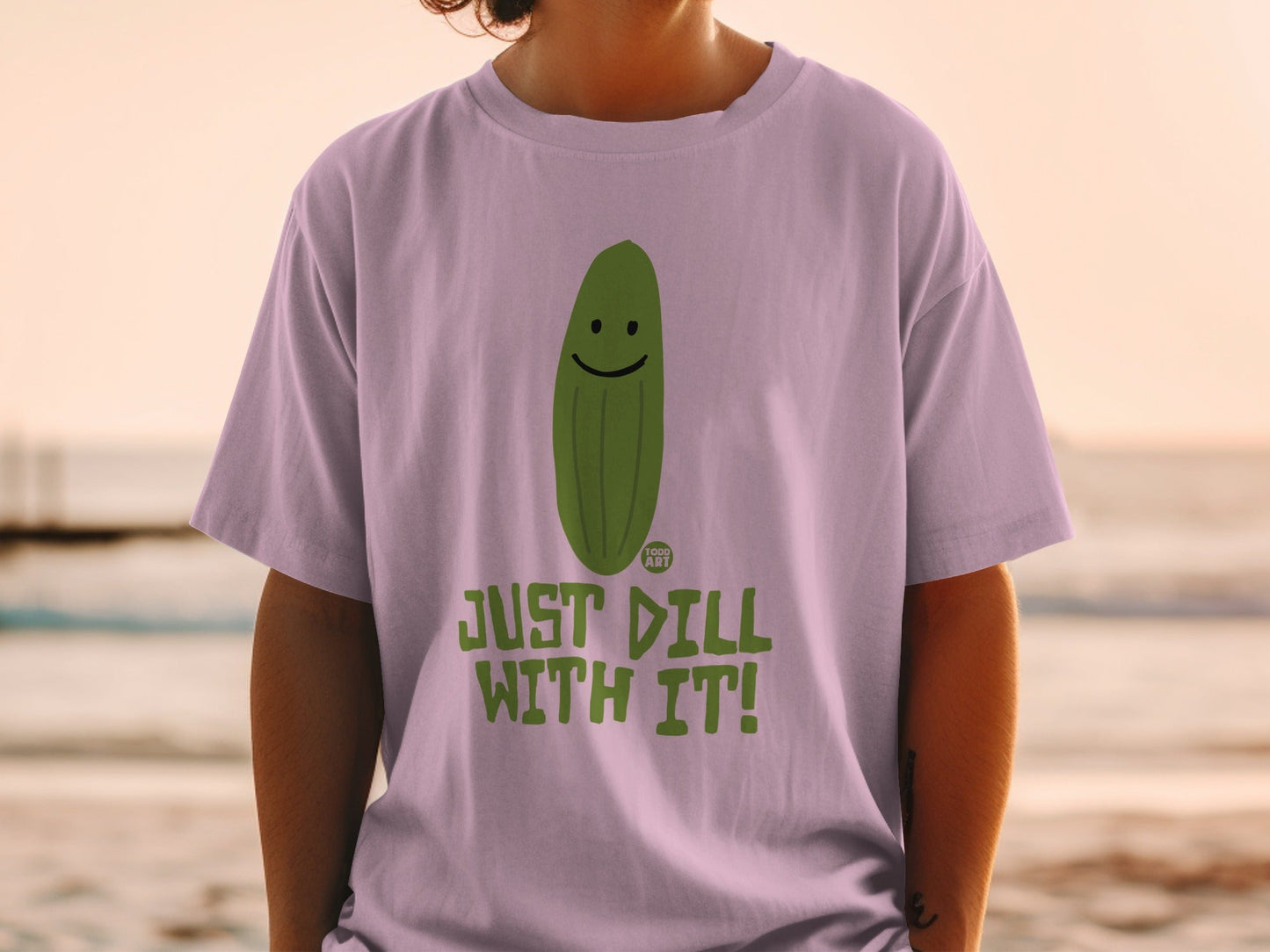 T-shirt with a smiling pickle and "JUST DILL WITH IT!" text.