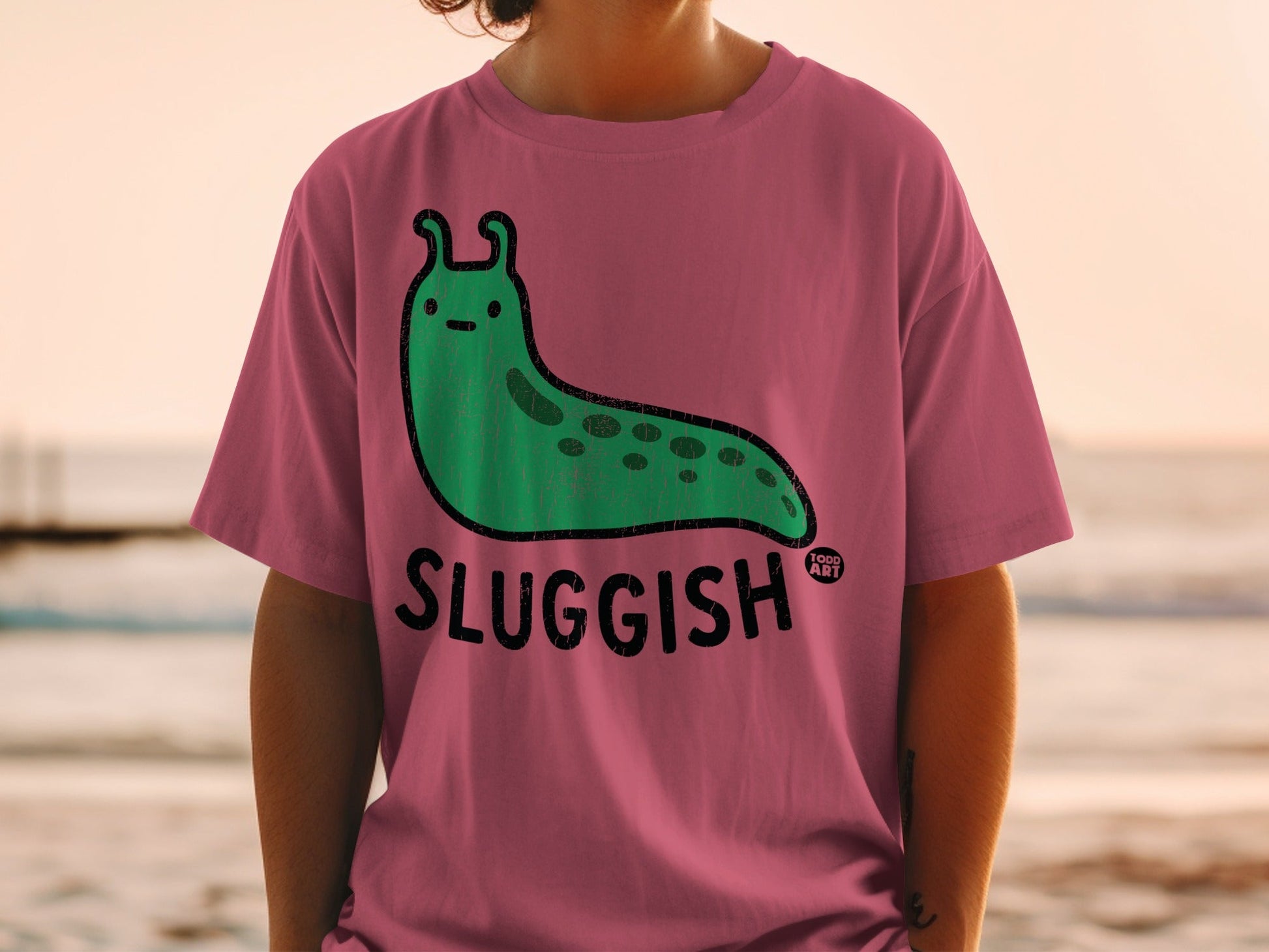 Pink Shirt with Green Sluggish Character Design Todd Art