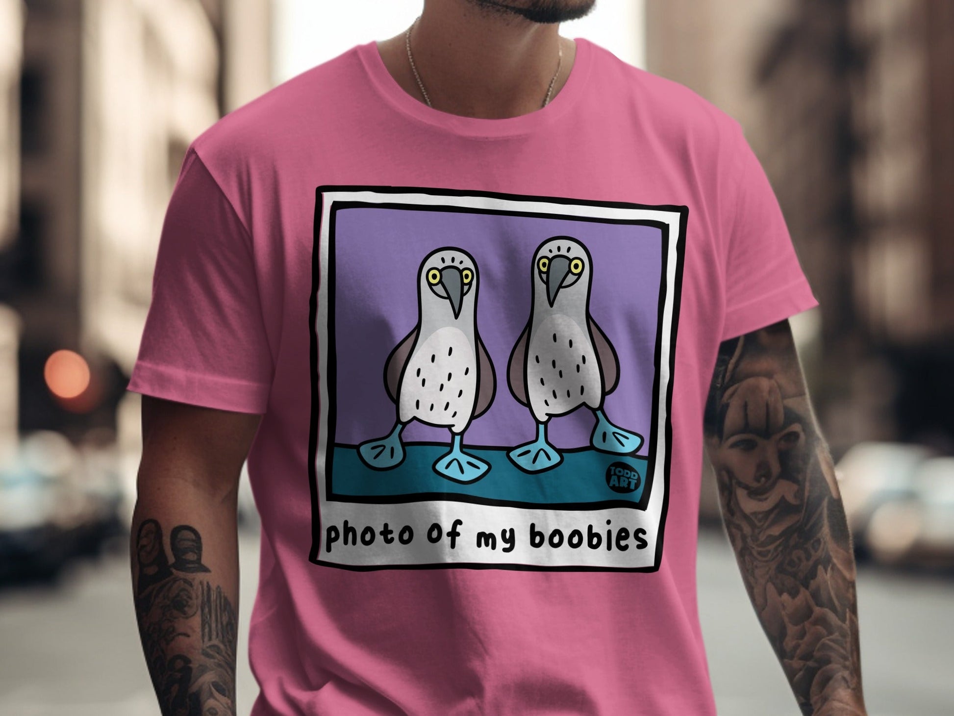 Pink t-shirt with illustration of two booby birds and "PHOTO OF MY BOOBIES" text.