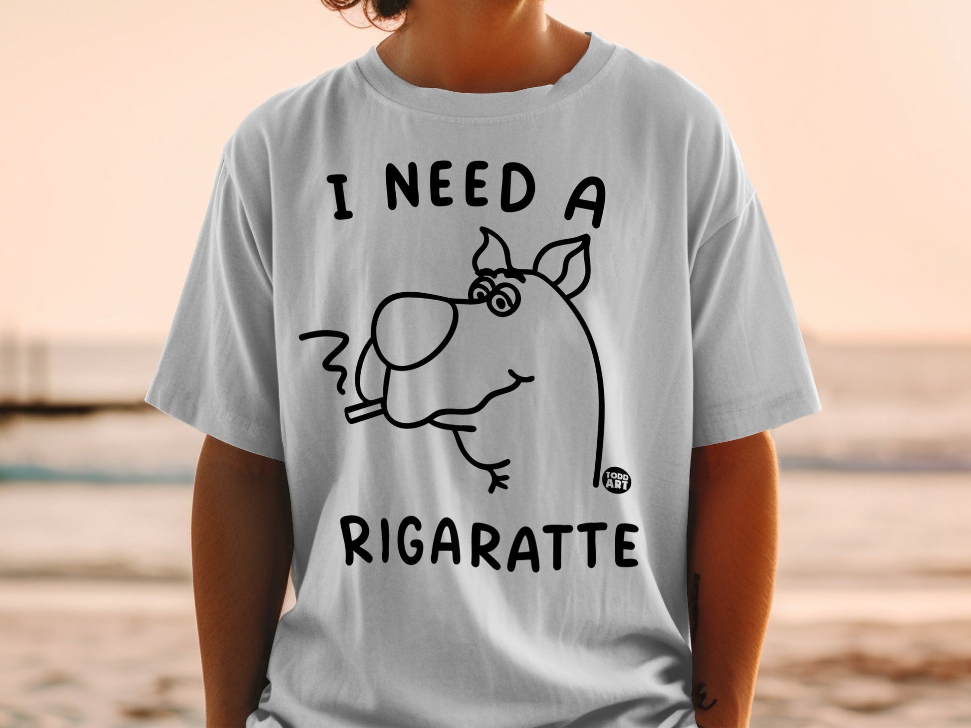 White t-shirt with Scooby-Doo cartoon smoking and text "I NEED A RIGARATTE".