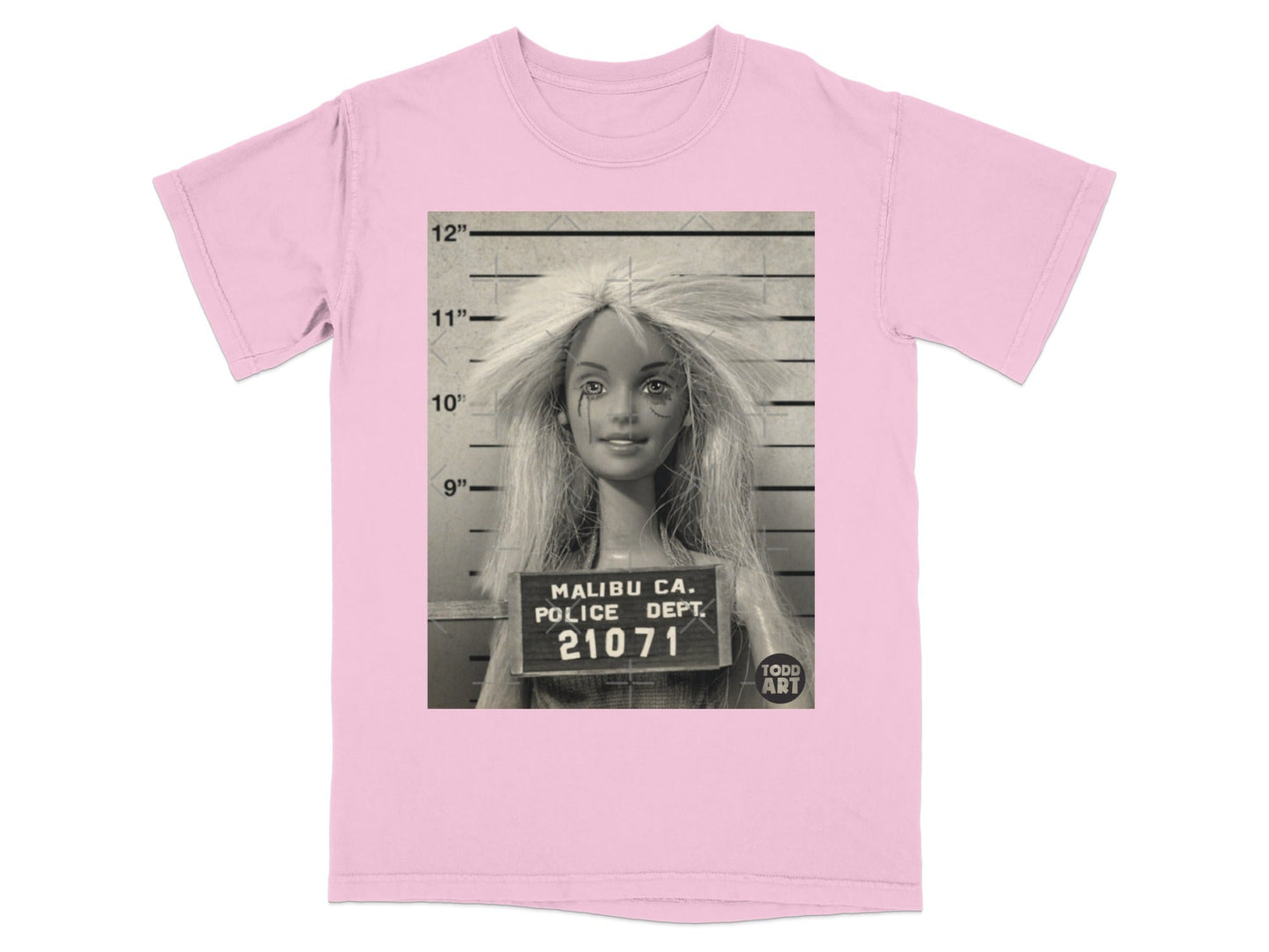 Pink t-shirt with a Barbie mugshot featuring "Malibu Ca. Police Dept. 21071".
