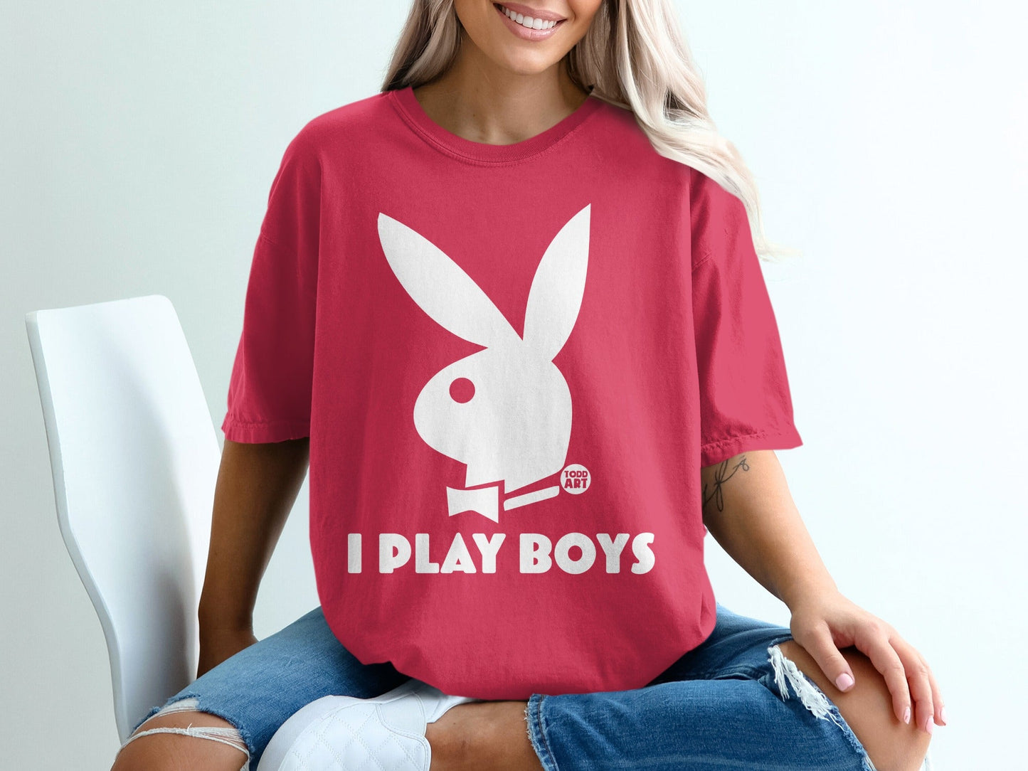 Red t-shirt with white Playboy bunny logo and "I PLAY BOYS" text.