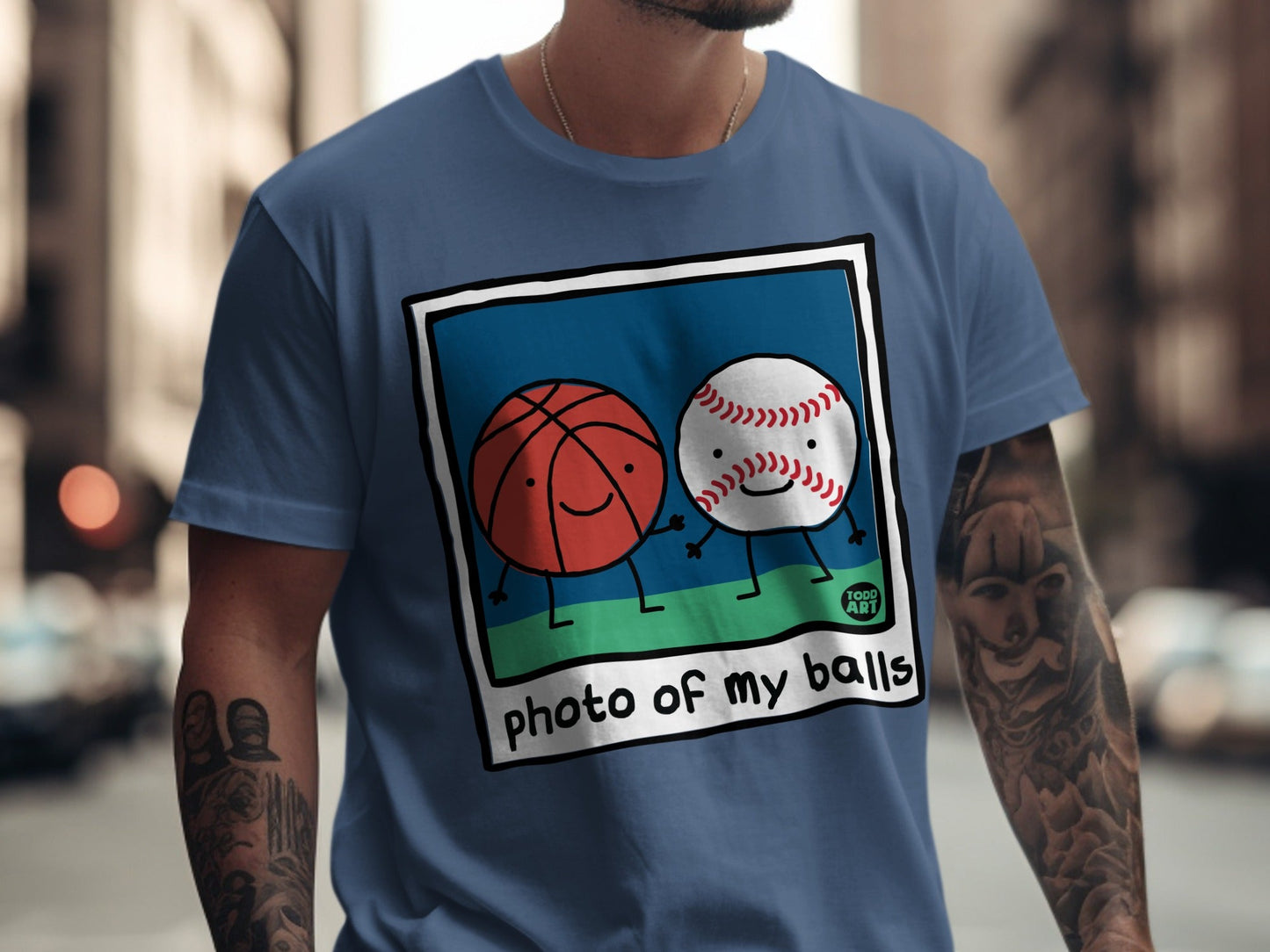 Basketball and baseball characters with smiling faces on a t-shirt.