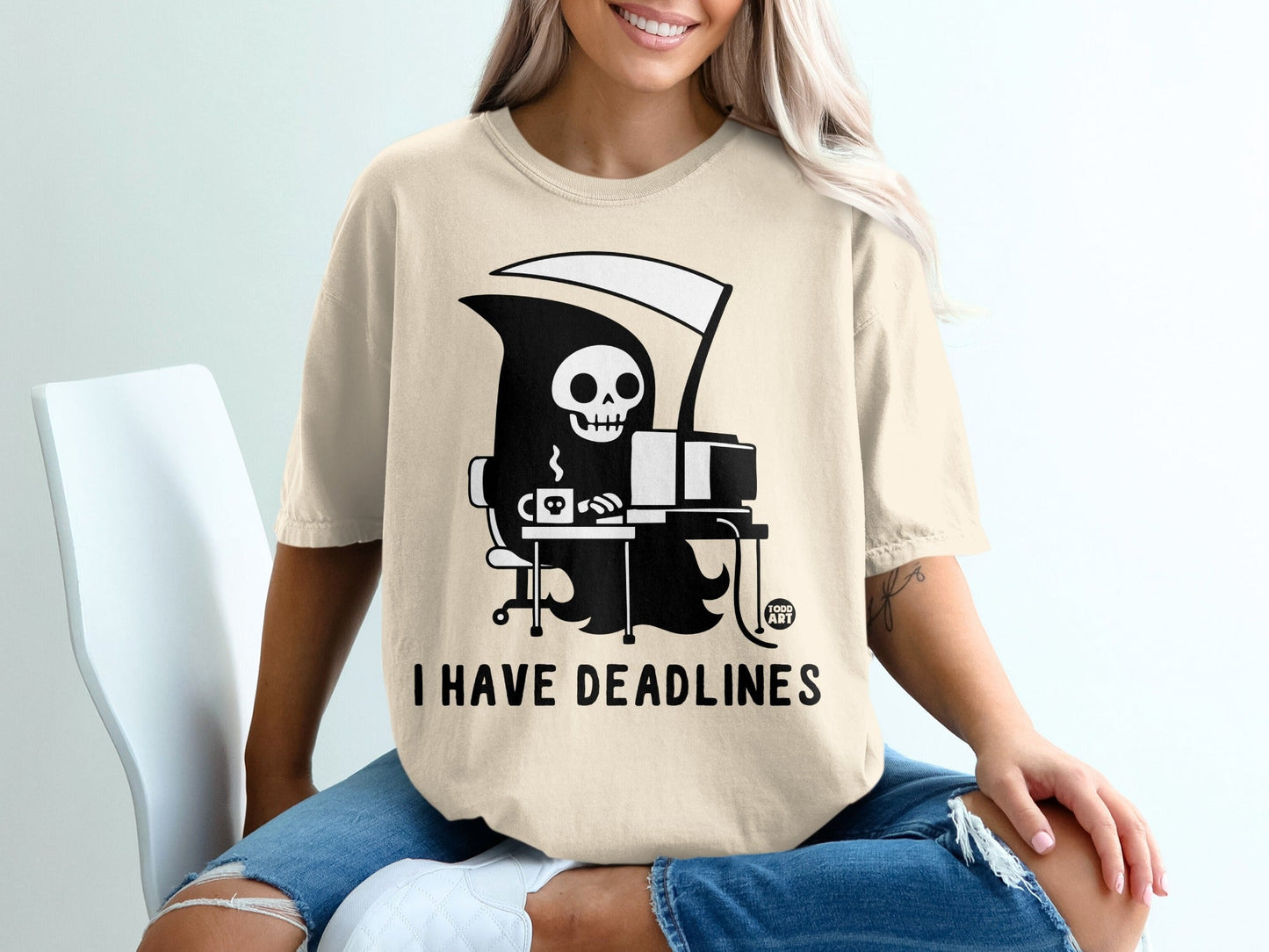 T-shirt graphic of Grim Reaper at a computer with text "I HAVE DEADLINES".